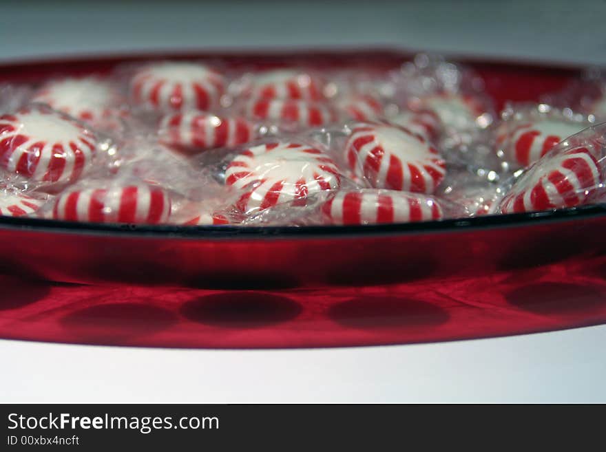 Red oblong bowl of peppermint candy. Red oblong bowl of peppermint candy