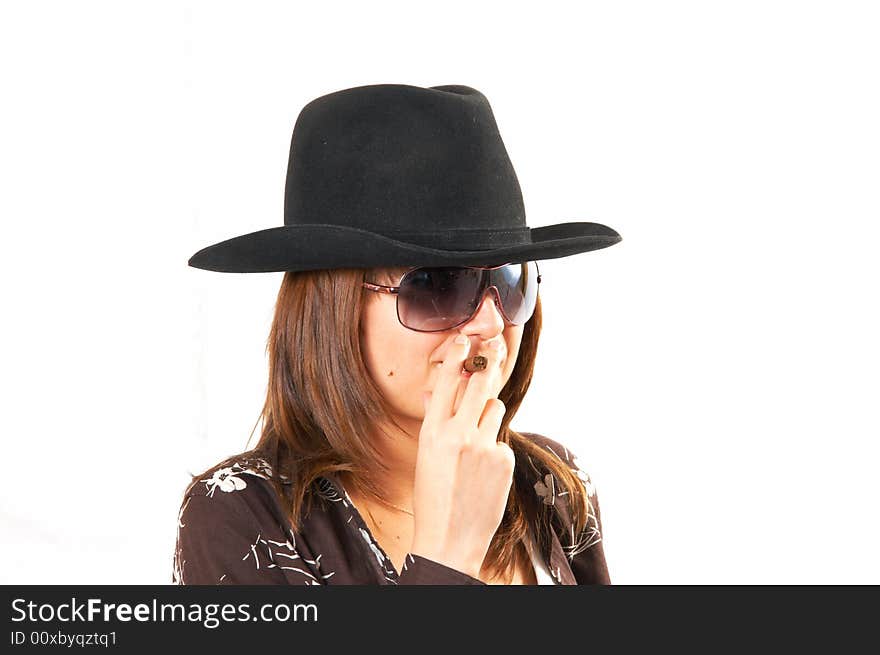 The girl in a brown jacket and a cowboy's hat. The girl in a brown jacket and a cowboy's hat