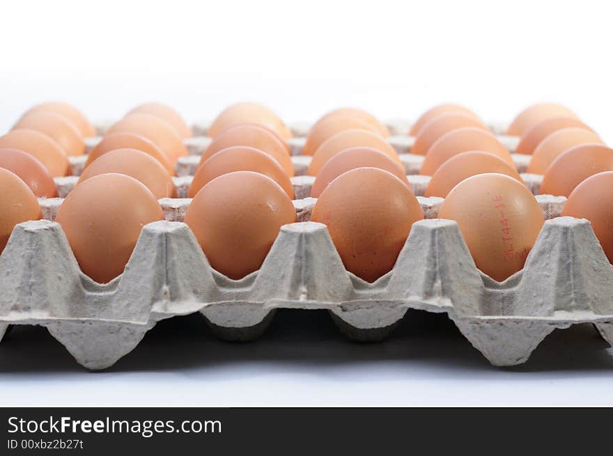 Eggs in a basket a over white background