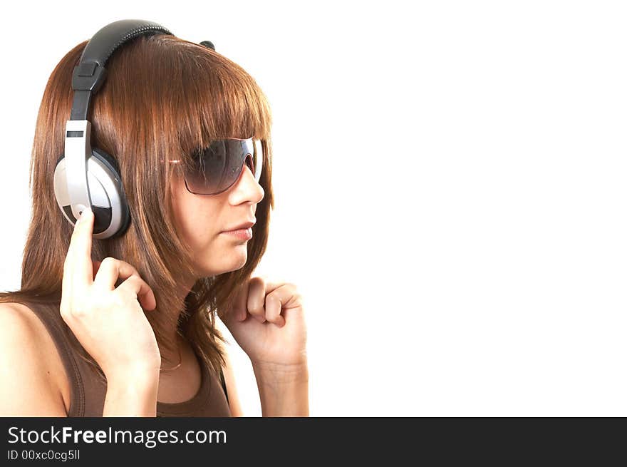 The girl in brown with headphones on a white background