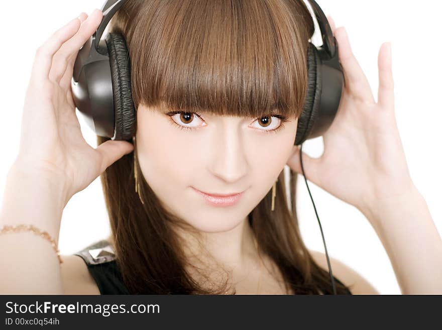 Portrait of a beautiful woman with earphones on white background. Portrait of a beautiful woman with earphones on white background