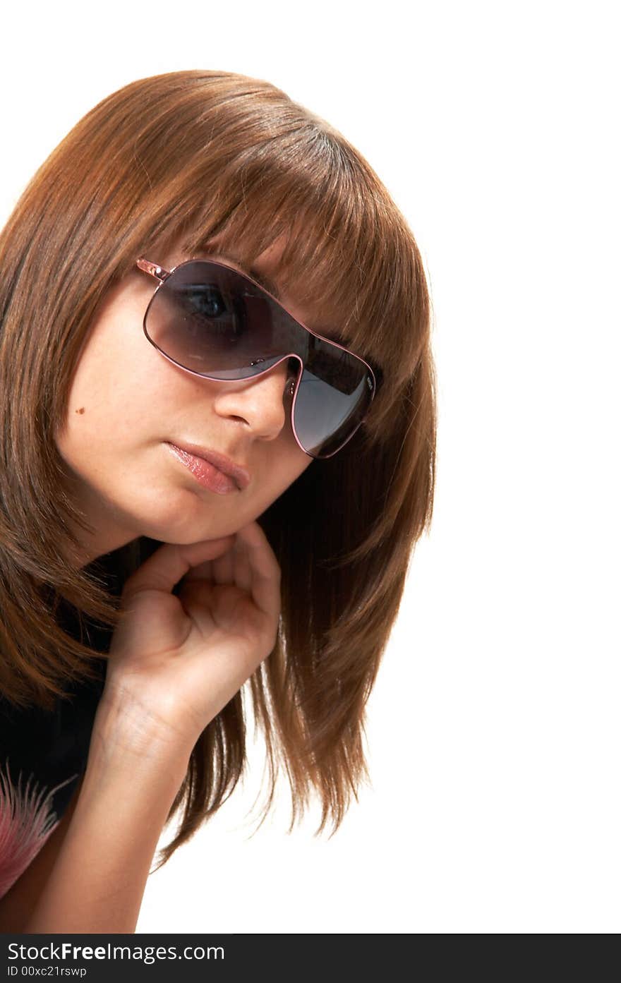 The girl in a black vest sits on a floor - a white background