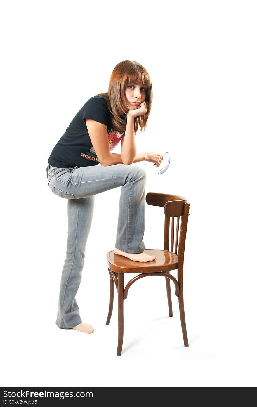 The girl with a chair on a white background