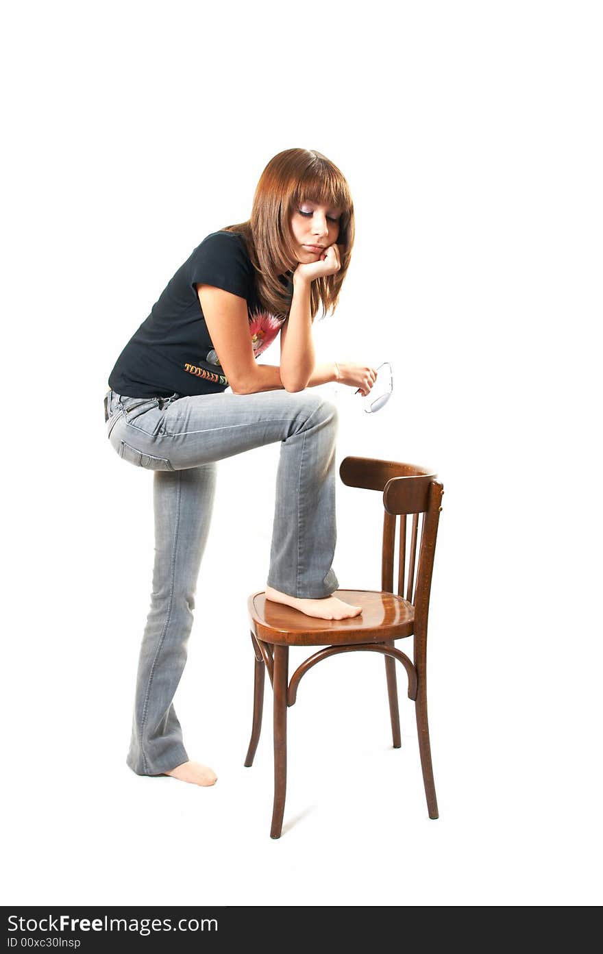 The girl with a chair on a white background