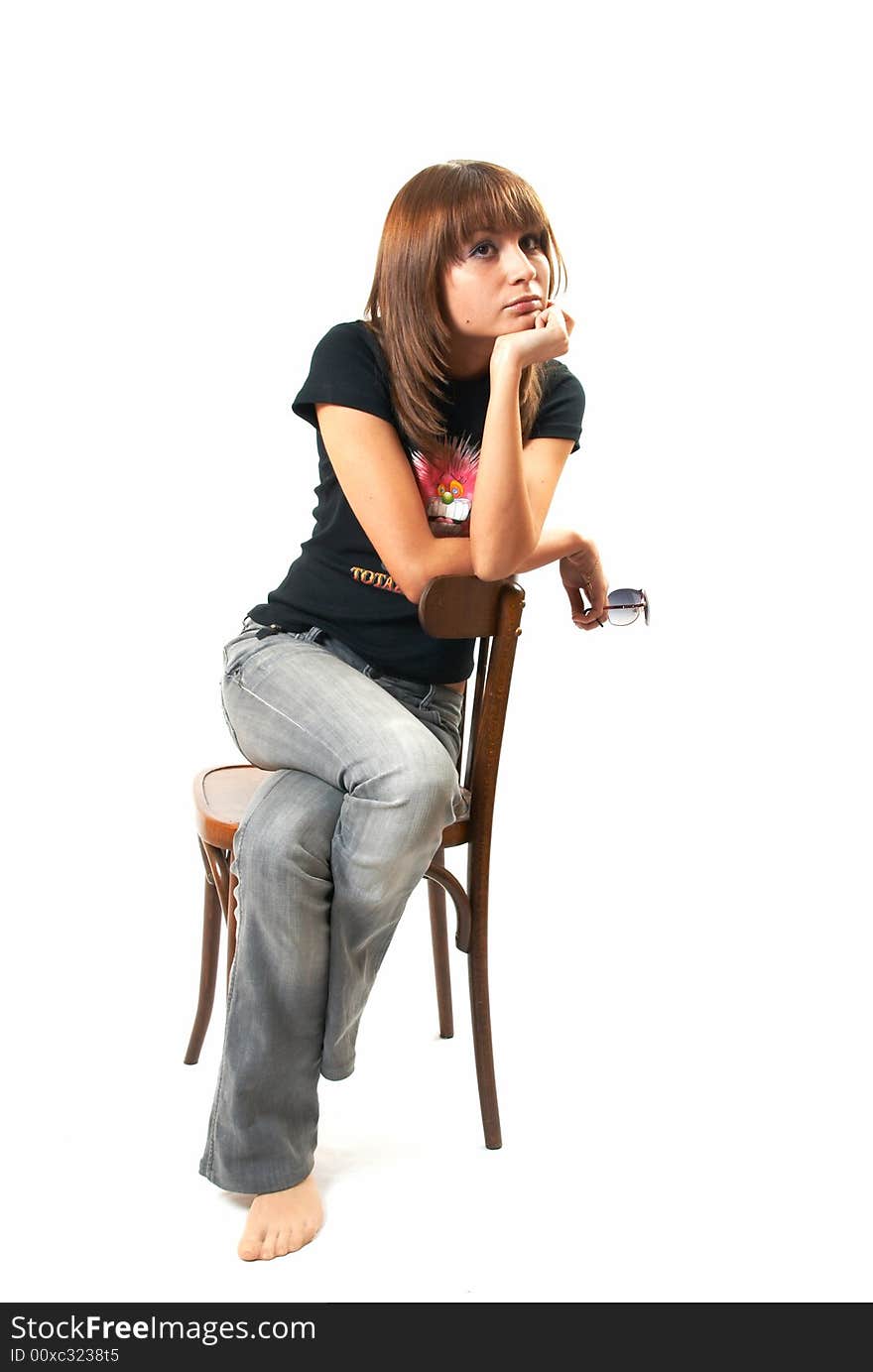 The girl with a chair on a white background