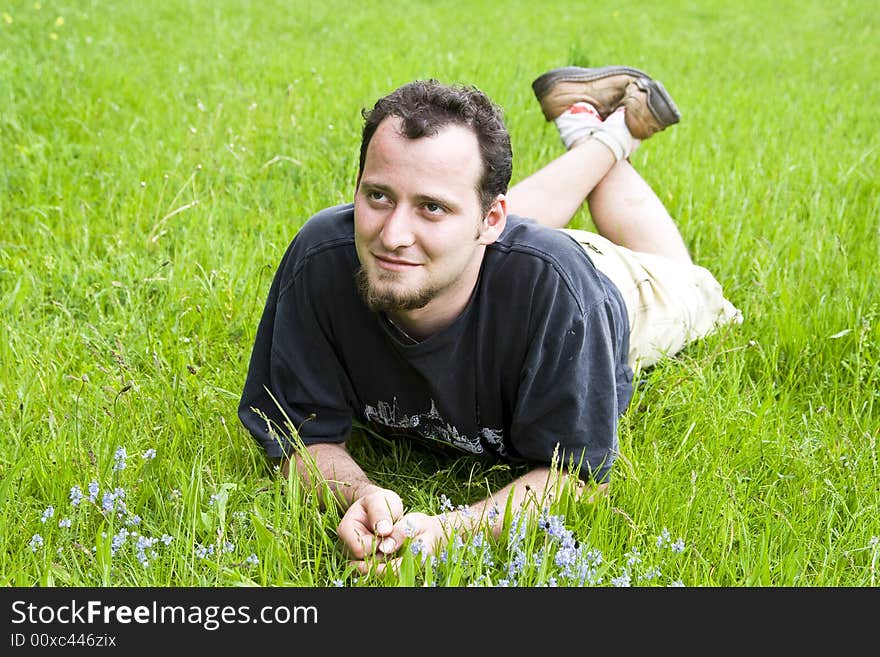 Young Man Laying In Grass