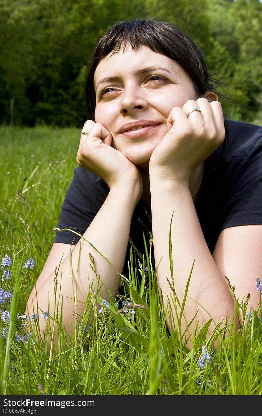 Young Girl Laying In Grass