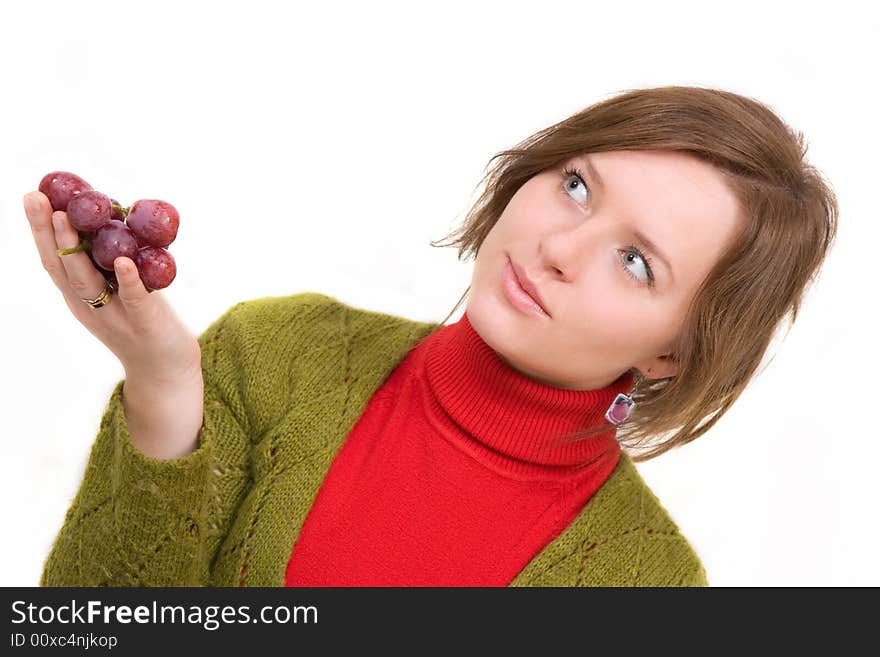 Young girl is holding grapes in the palm