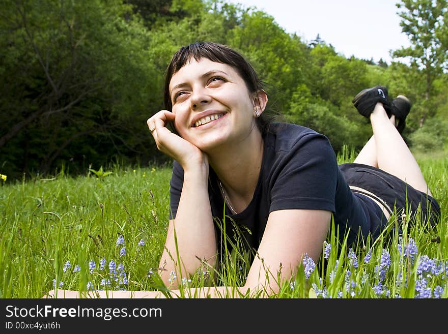 Young Girl Laying In Grass