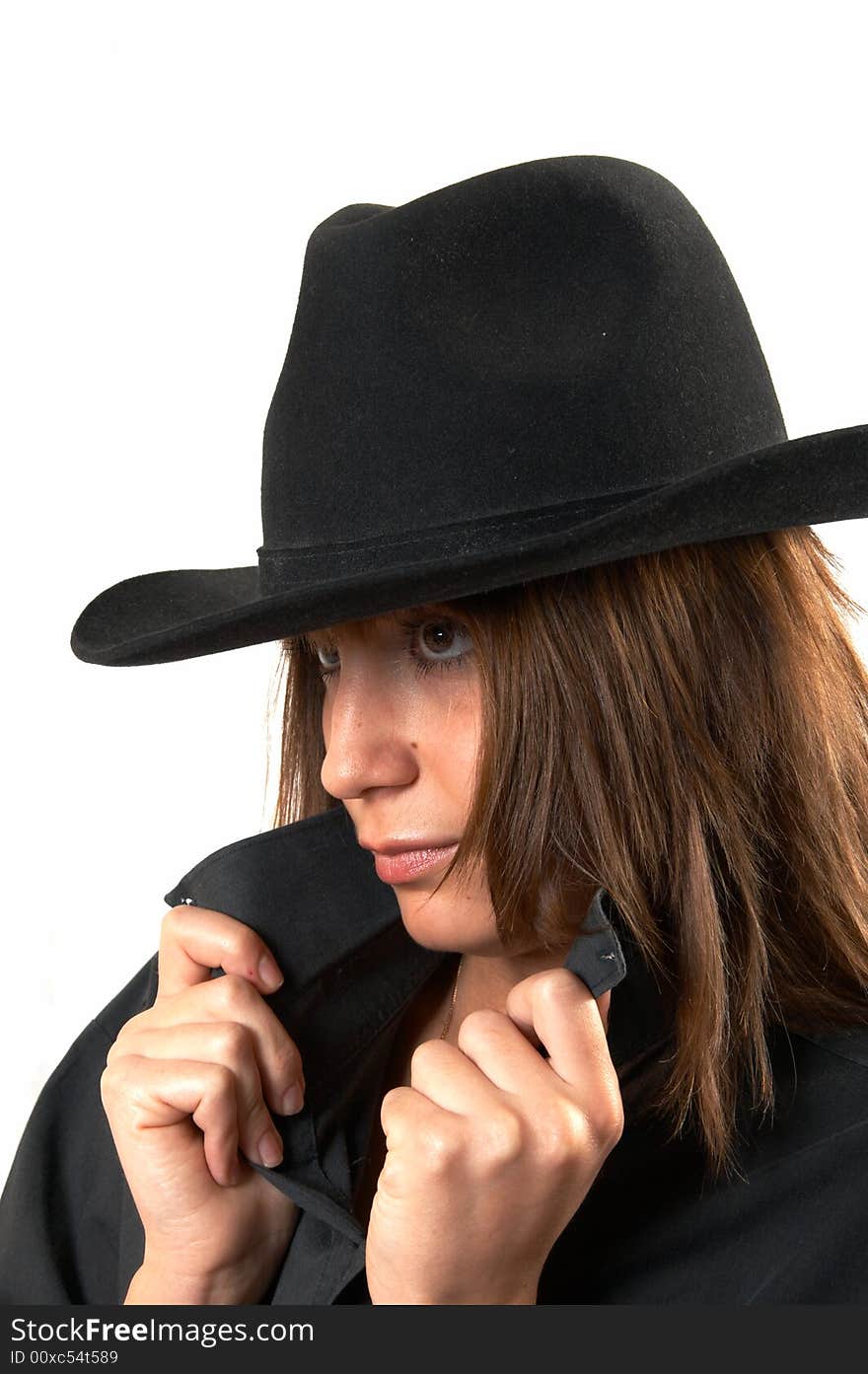 Girl in a black shirt and a cowboy s hat