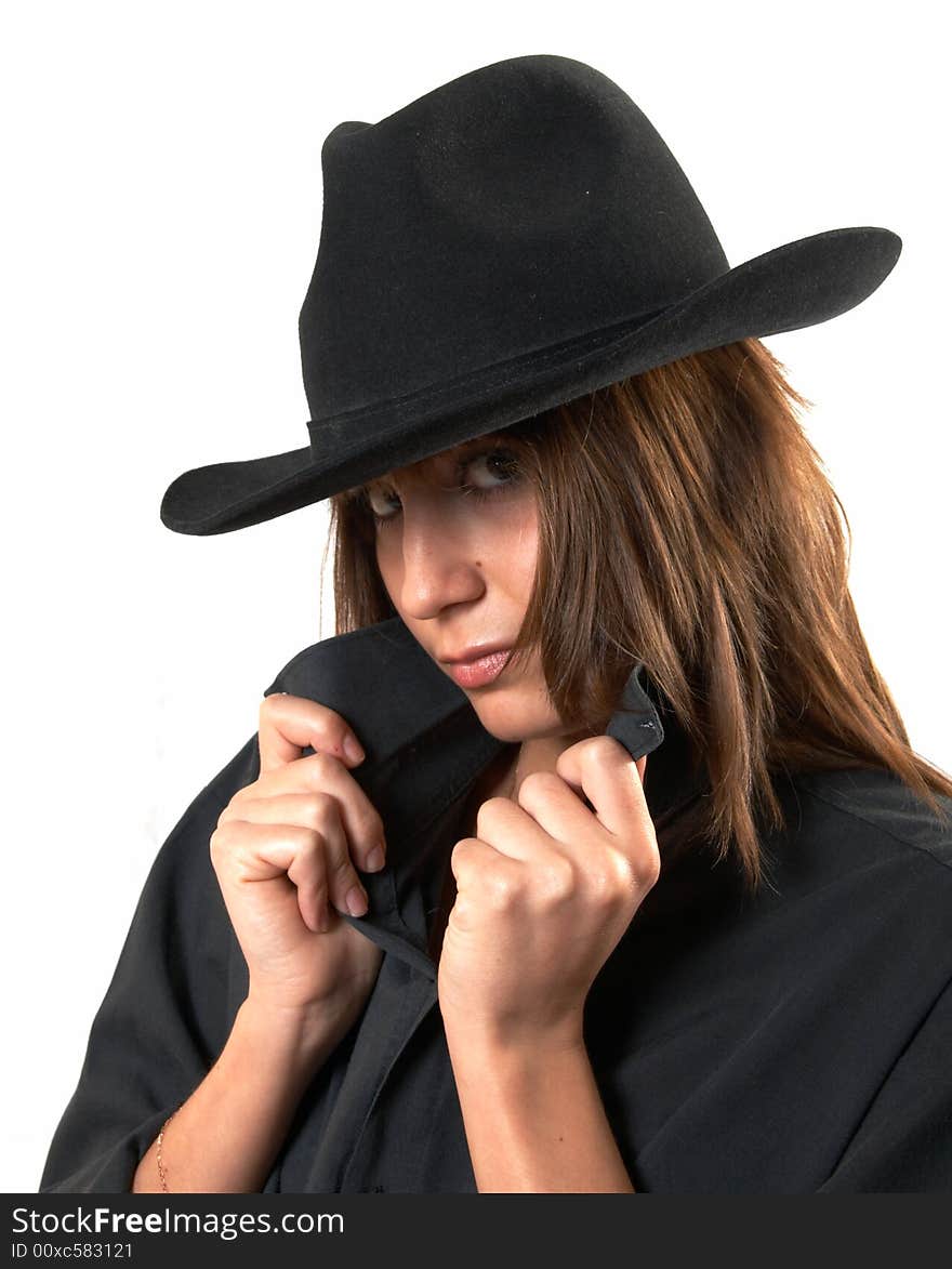 Girl in a black shirt and a cowboy s hat