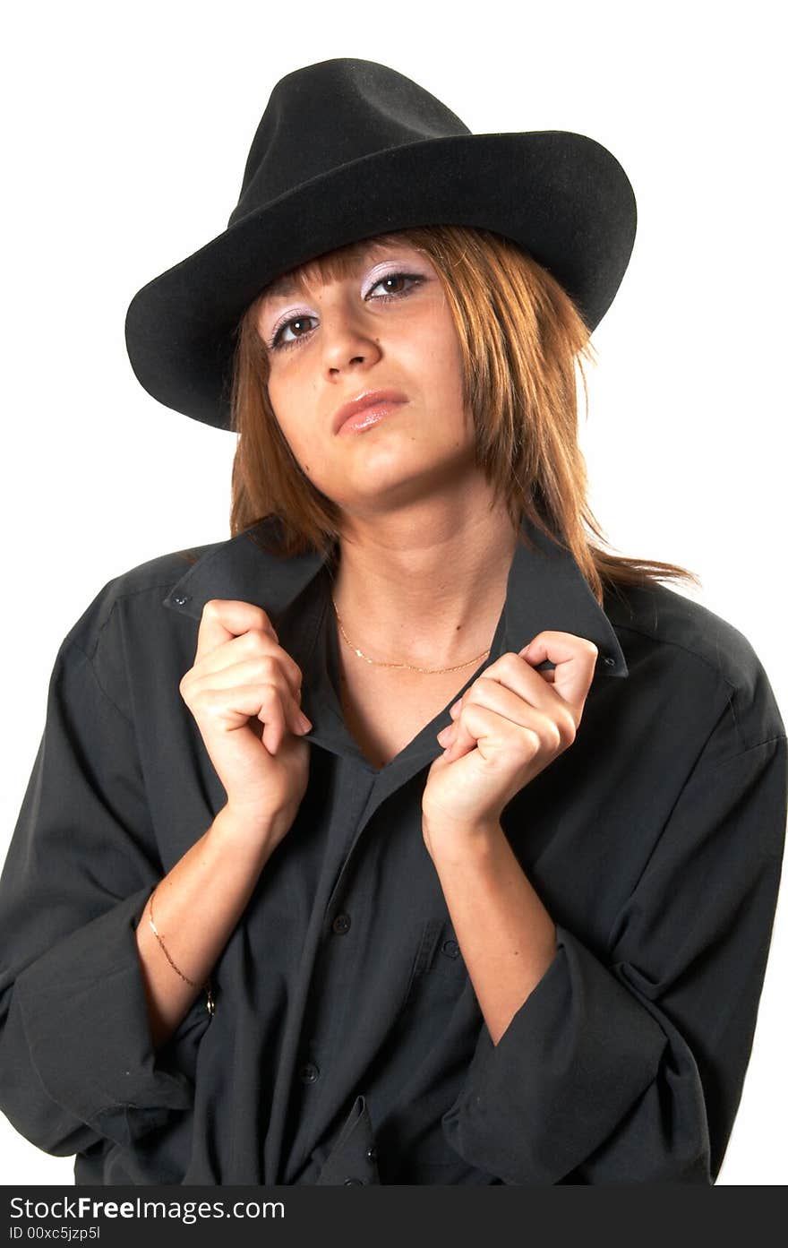 Girl in a black shirt and a cowboy s hat