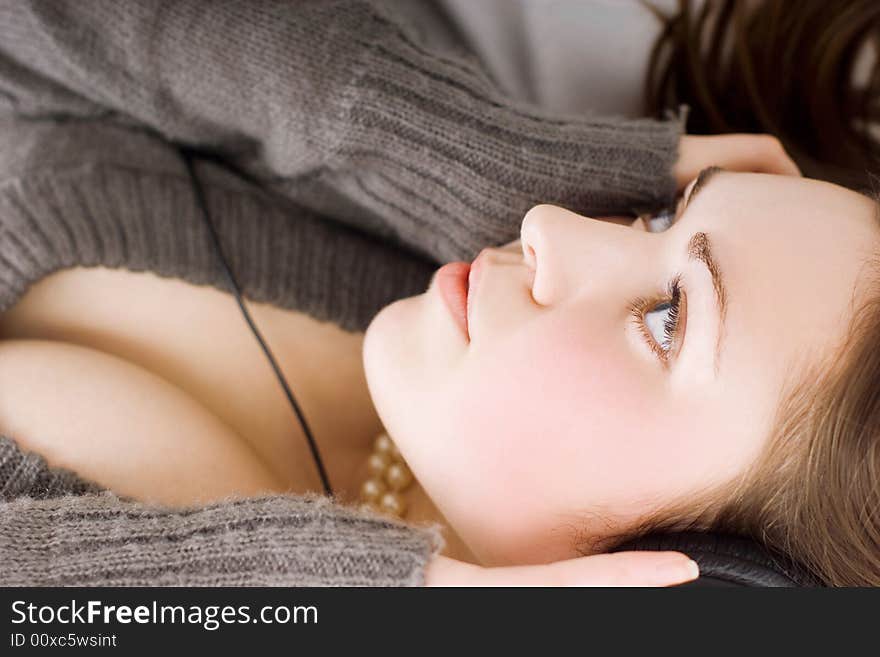 Cute brunette with earphones