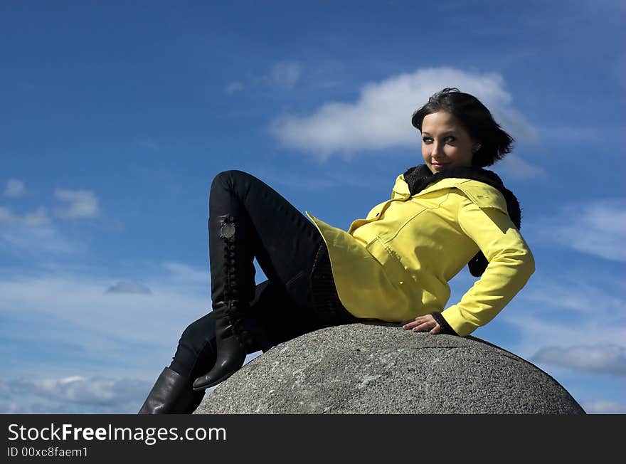 The girl on a background of the sky