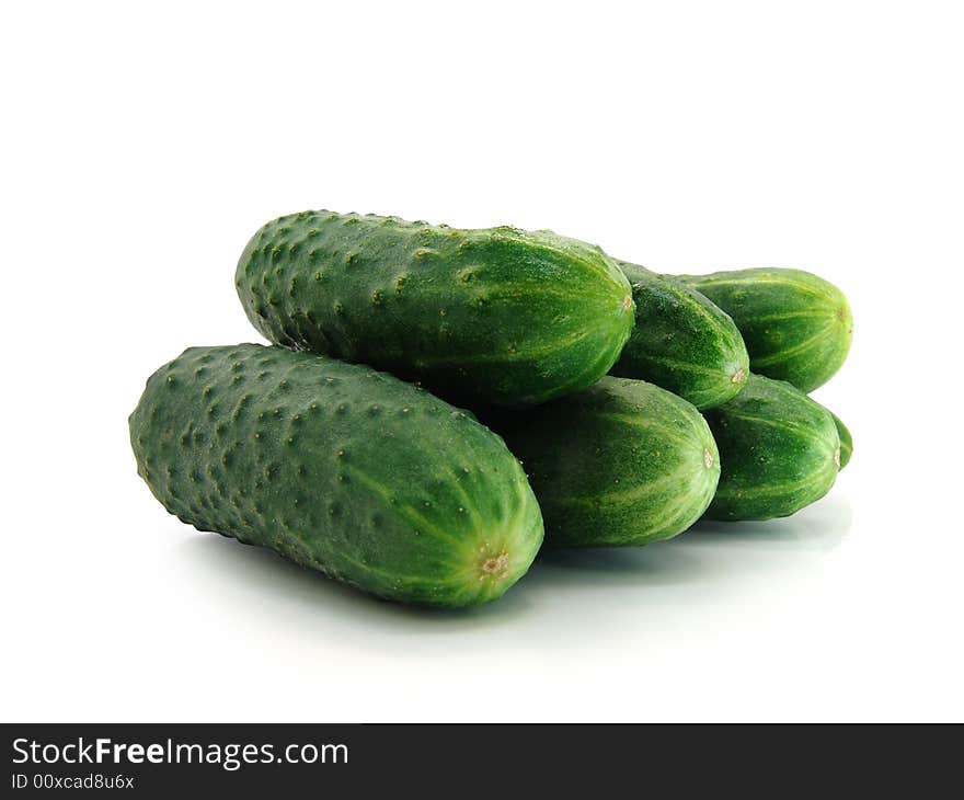 Fresh green cucumbers on a white background. Fresh green cucumbers on a white background