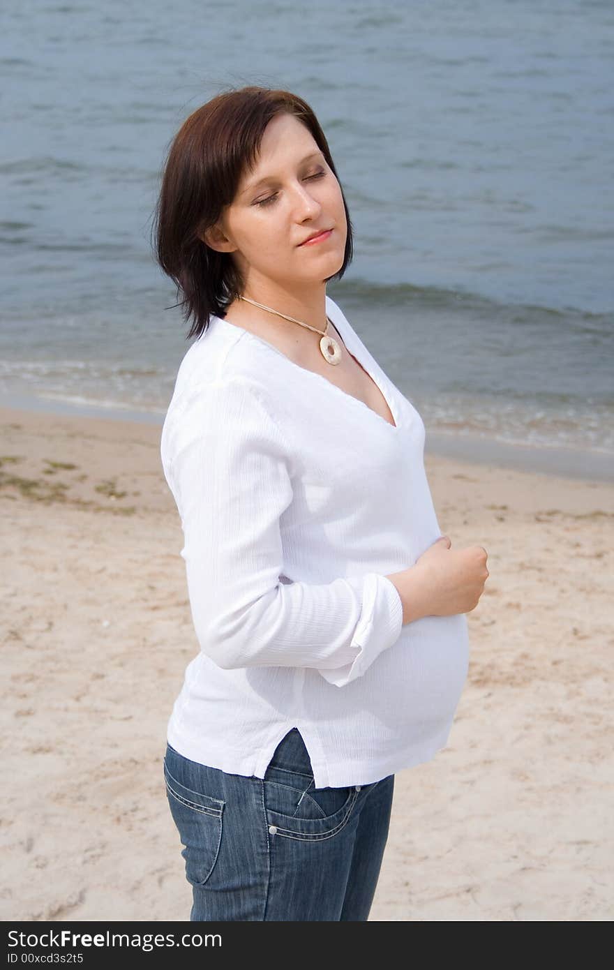 Pregnant woman on the beach