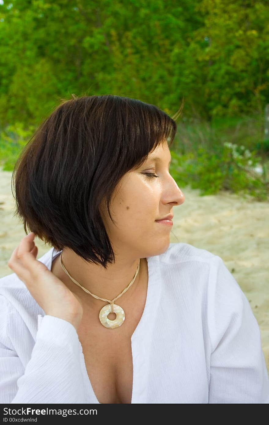 Woman sitting on the beach. Woman sitting on the beach