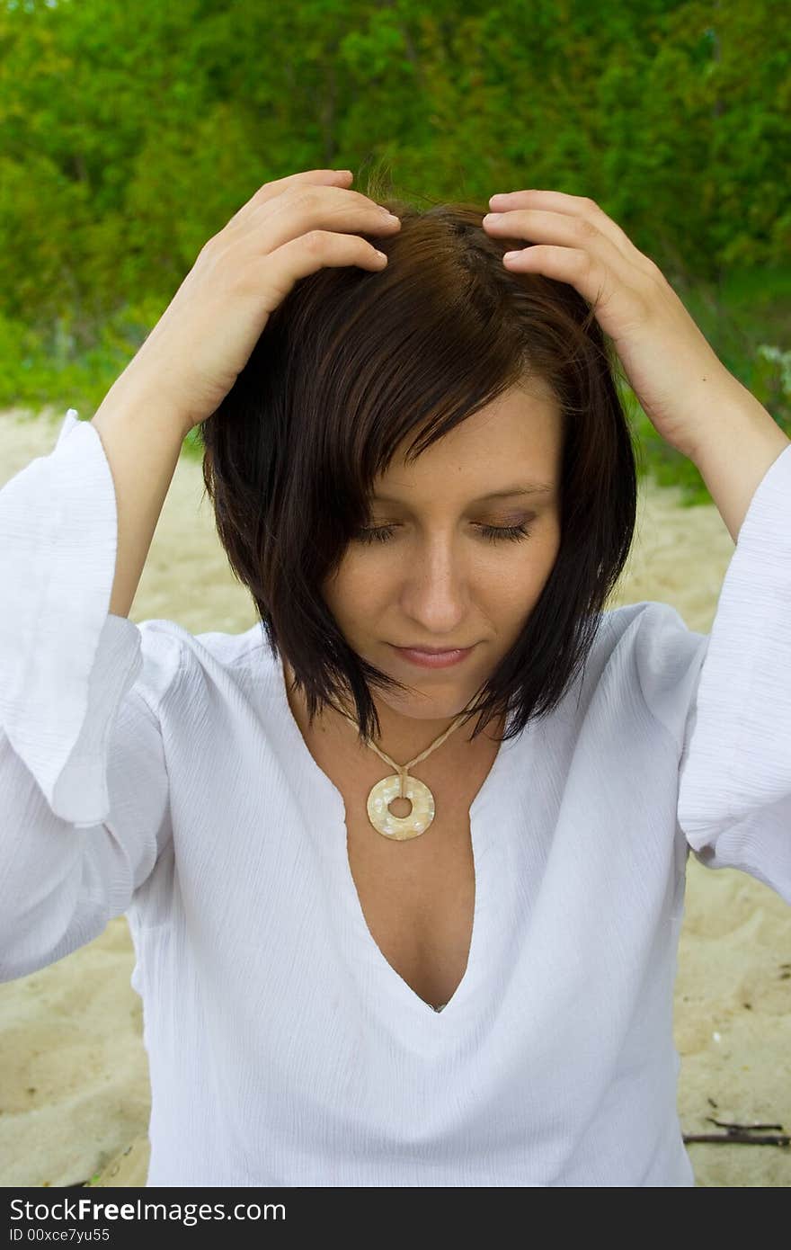 Woman sitting on the beach. Woman sitting on the beach