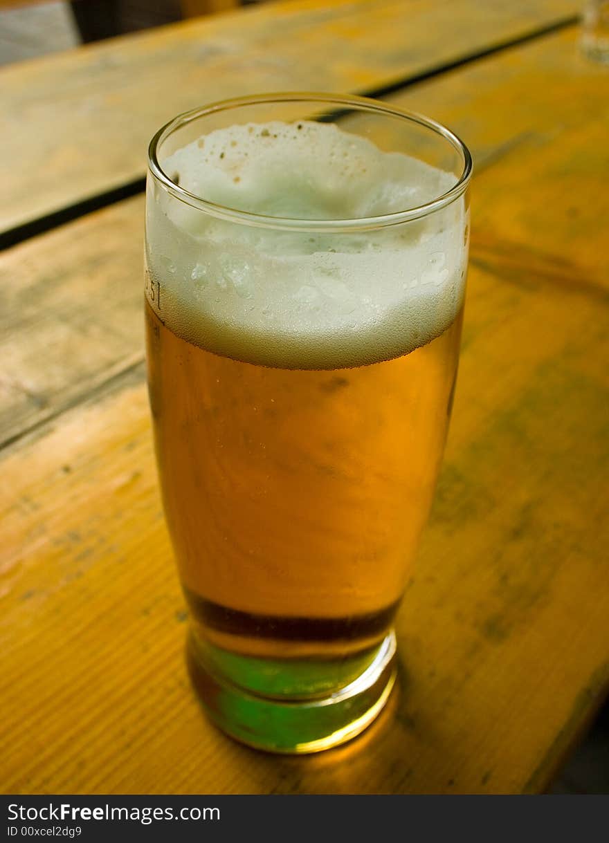 Cold beer in glass on the table