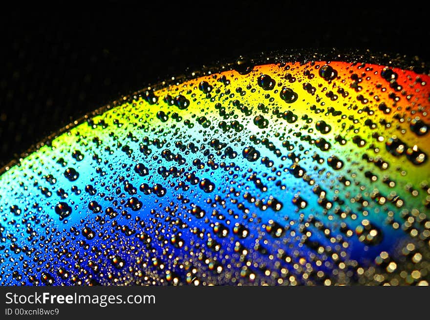 Abstract view of CD covered with water drops. Abstract view of CD covered with water drops