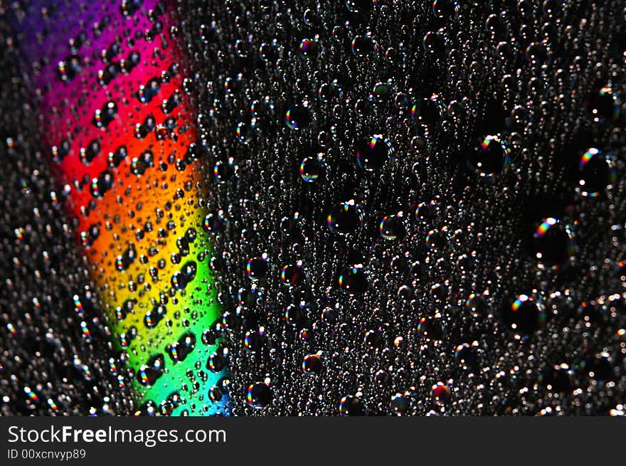 Abstract view of CD covered with water drops. Abstract view of CD covered with water drops