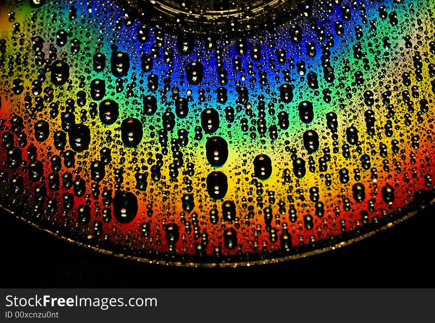 Abstract view of CD covered with water drops. Abstract view of CD covered with water drops