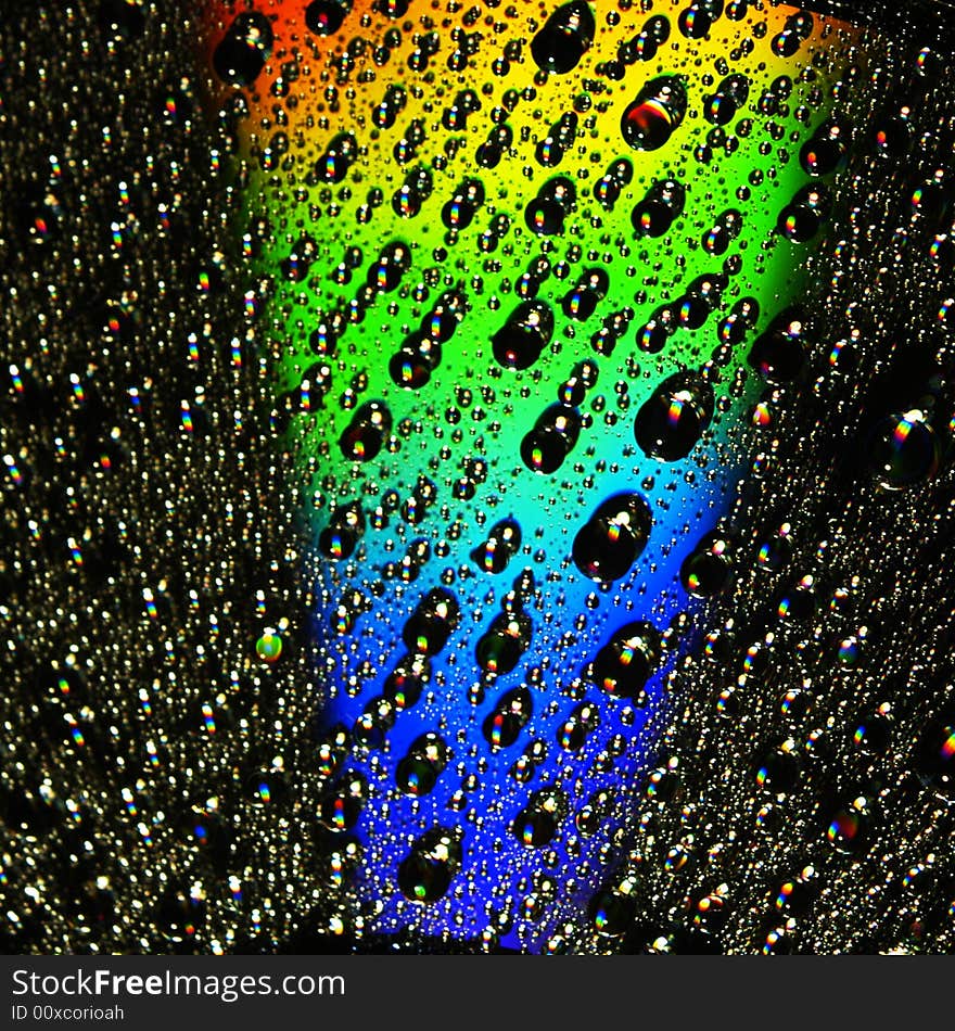 Abstract view of CD covered with water drops. Abstract view of CD covered with water drops