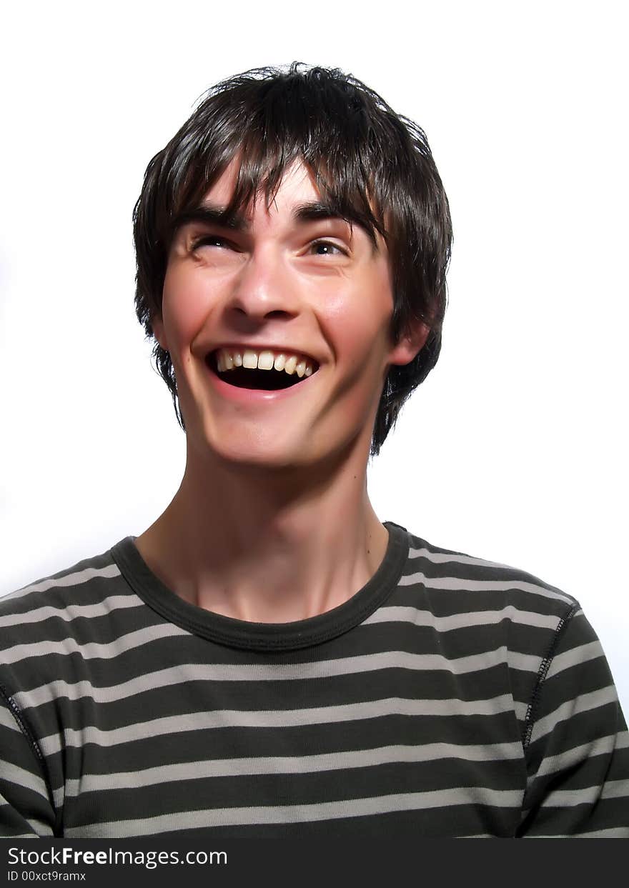 A portrait about a trendy attractive young guy who is looking up and he is laughing loud. He is wearing a striped t-shirt. A portrait about a trendy attractive young guy who is looking up and he is laughing loud. He is wearing a striped t-shirt.