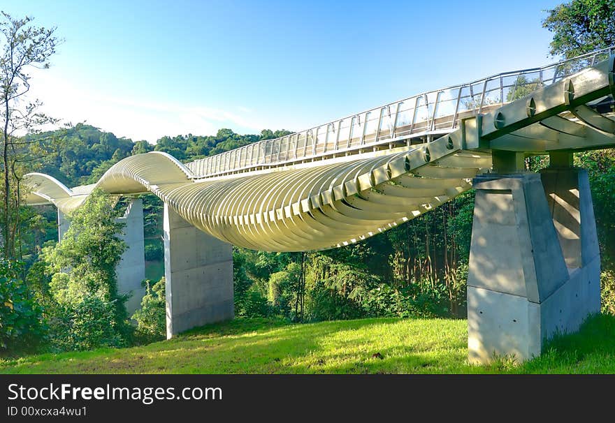 Bridge over a high valley with a sinuous curve design at dawn. Bridge over a high valley with a sinuous curve design at dawn