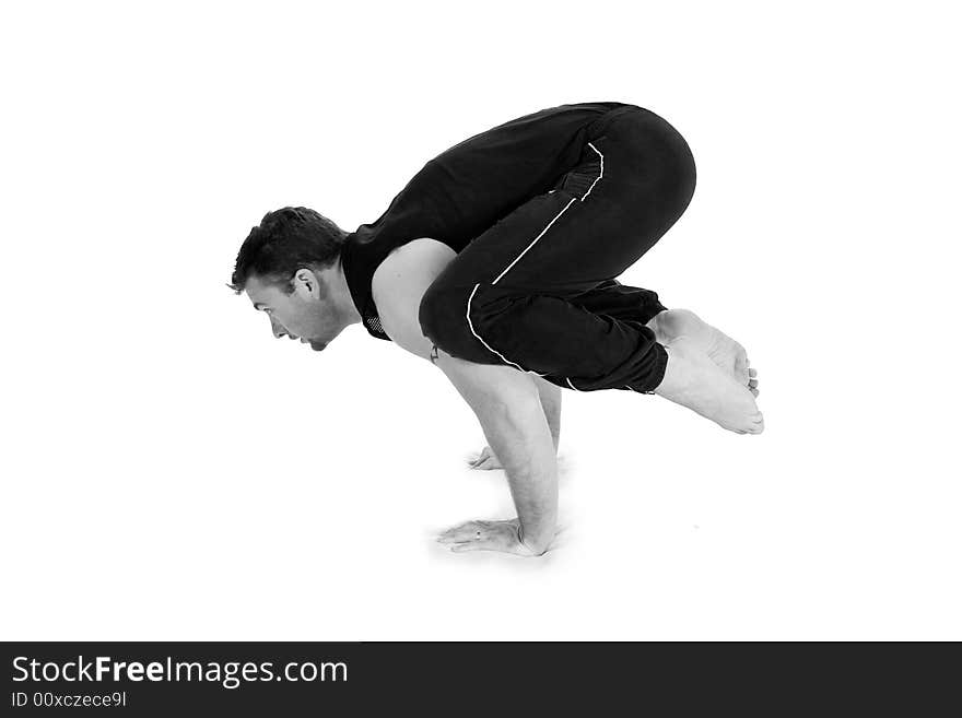 Young male gymnast practicing yoga. Young male gymnast practicing yoga.