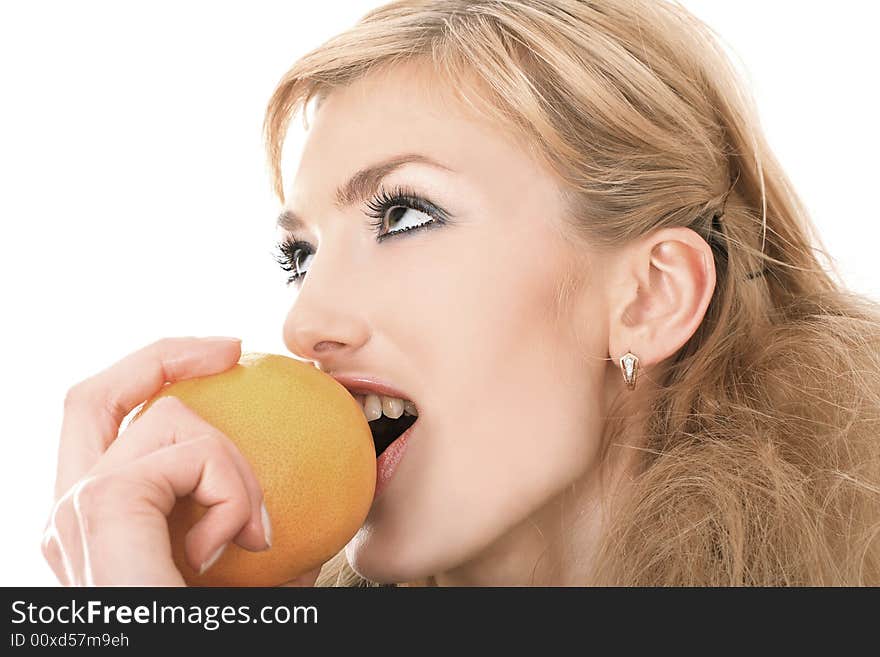 Sexy blonde eating orrange on white background. Sexy blonde eating orrange on white background