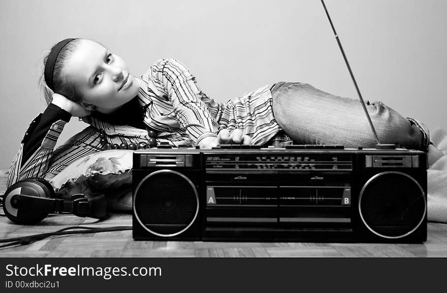 Young woman is listening radio