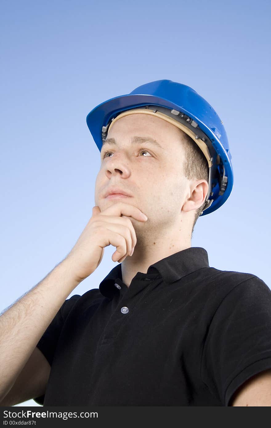 Male thinks while working on a real estate project. Male thinks while working on a real estate project