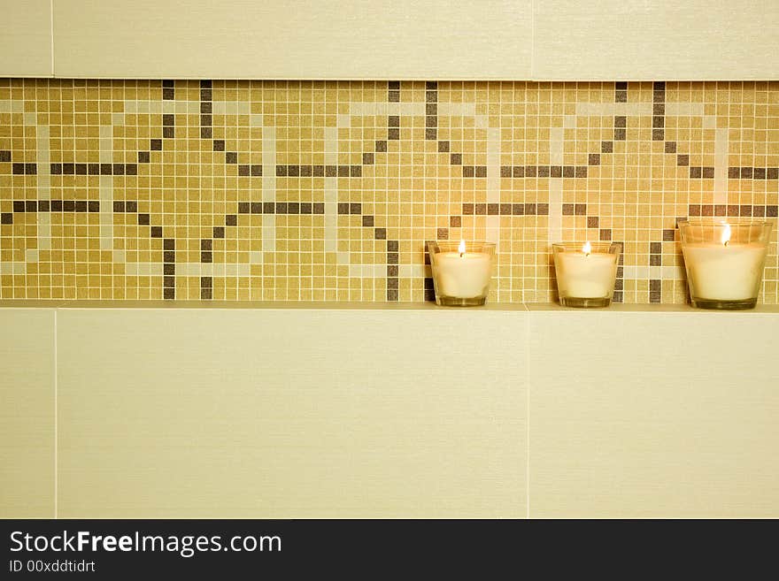 Detail of brown modern bathroom with candle