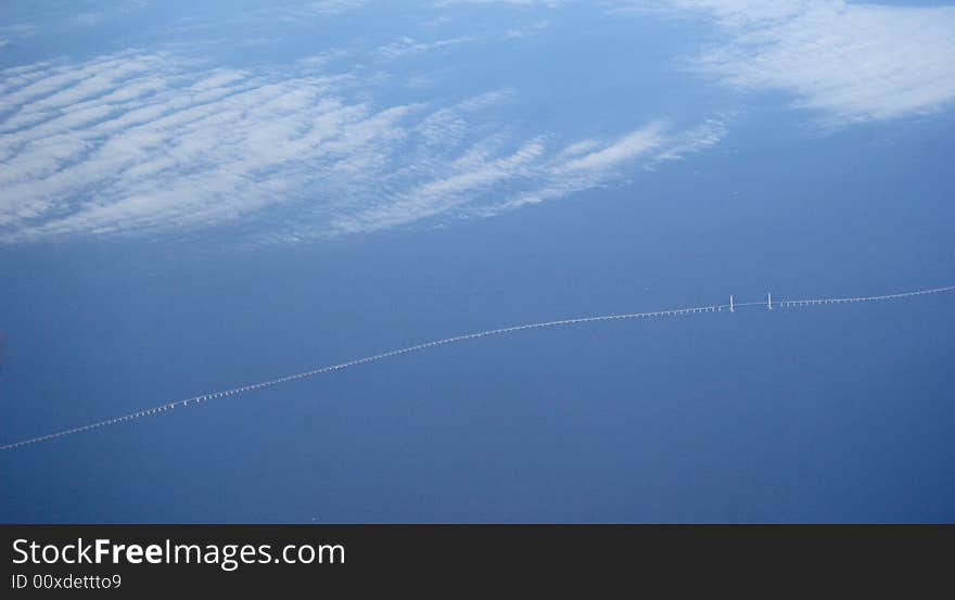 The bridge spanning the sea of gulf of Hangzhou is the longest bridge building in the world at present, total length is 36 kilometers. This photo is shot while going by air. The bridge spanning the sea of gulf of Hangzhou is the longest bridge building in the world at present, total length is 36 kilometers. This photo is shot while going by air.