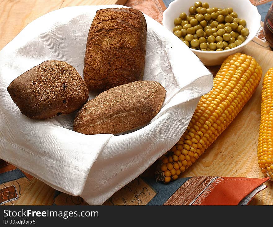 Appetizing rolls of bread with corn