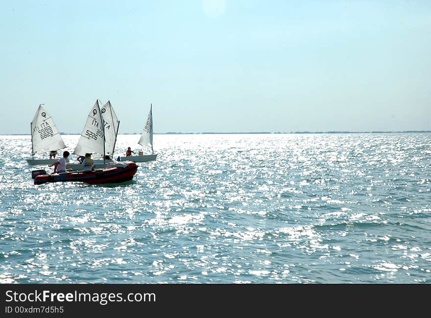 Young people sailing under clear sky. Young people sailing under clear sky