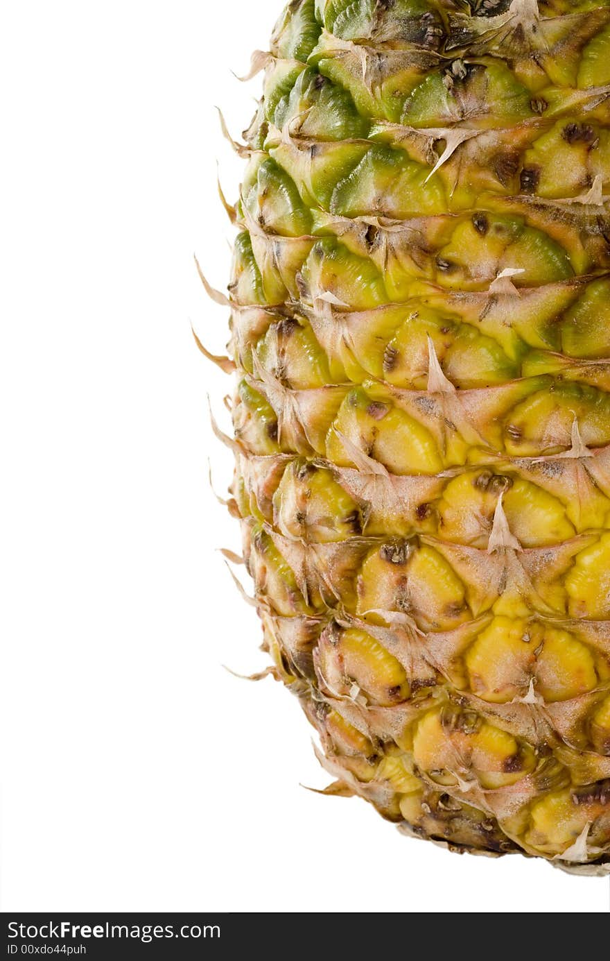 A whole pineapple isolated on a white background.