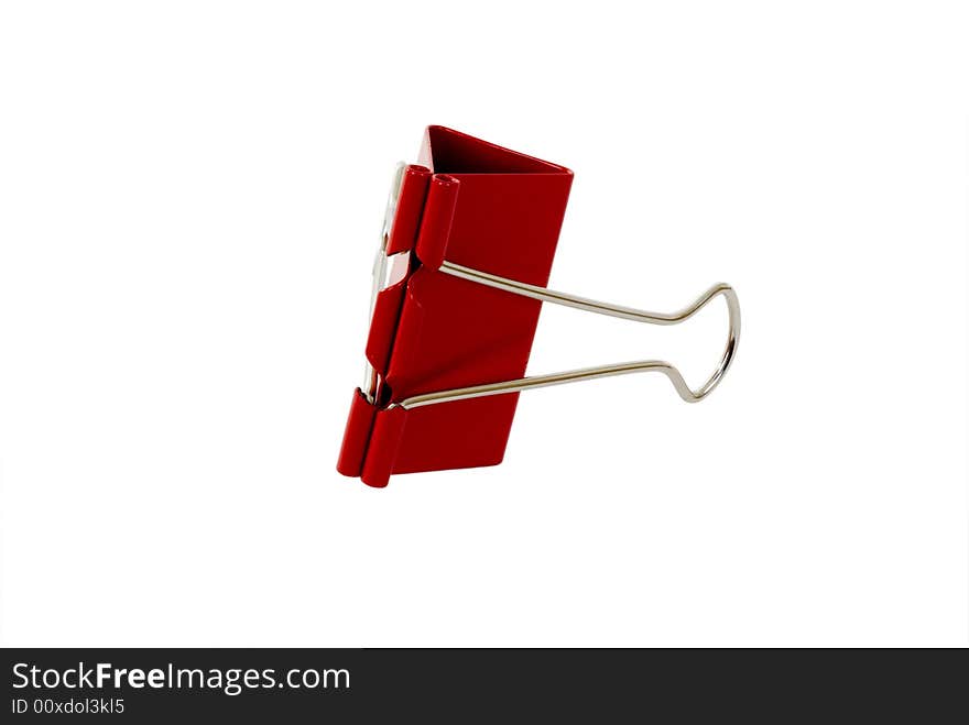 A red binder clip isolated on white with clipping path.