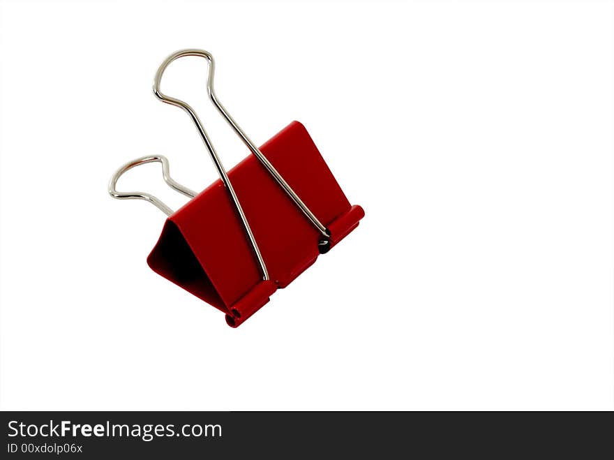 A red binder clip isolated on white with clipping path.