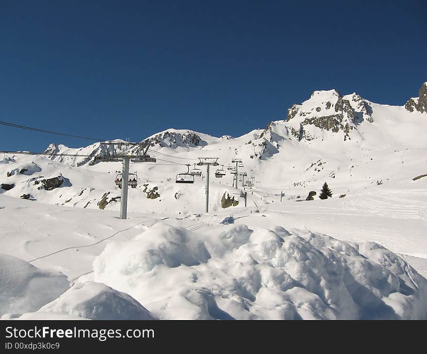 A stunning view on the mountains with snow on a beautiful winterday in Les Sybelles France. A stunning view on the mountains with snow on a beautiful winterday in Les Sybelles France