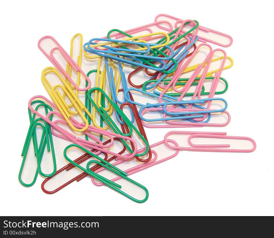 Multi-colored paper clips on a white background. Multi-colored paper clips on a white background