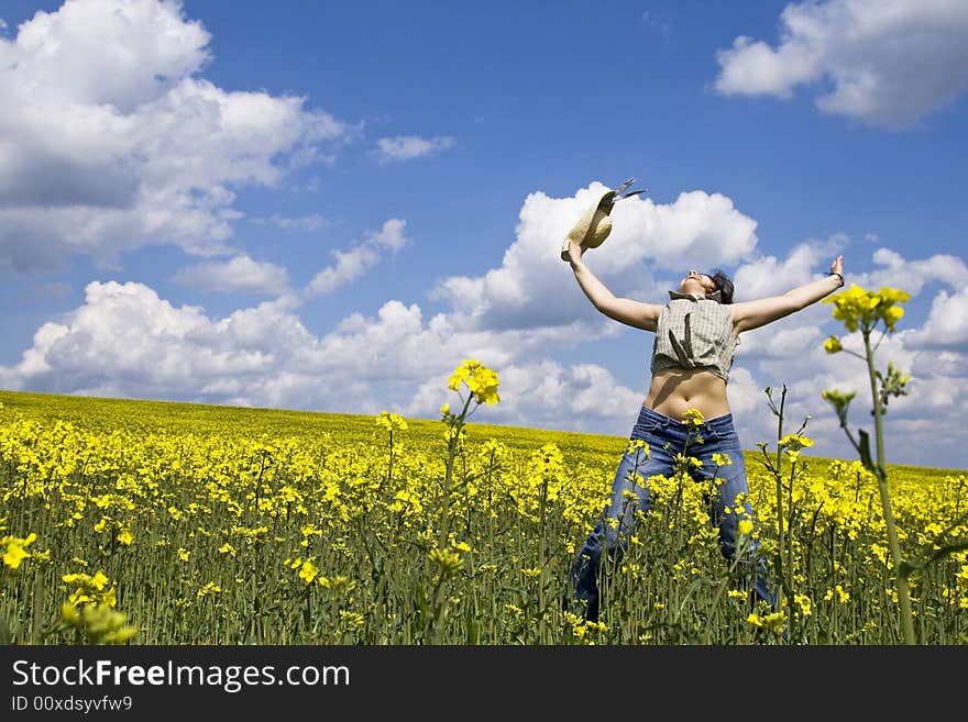 Girl having fun in summer rape field. Girl having fun in summer rape field