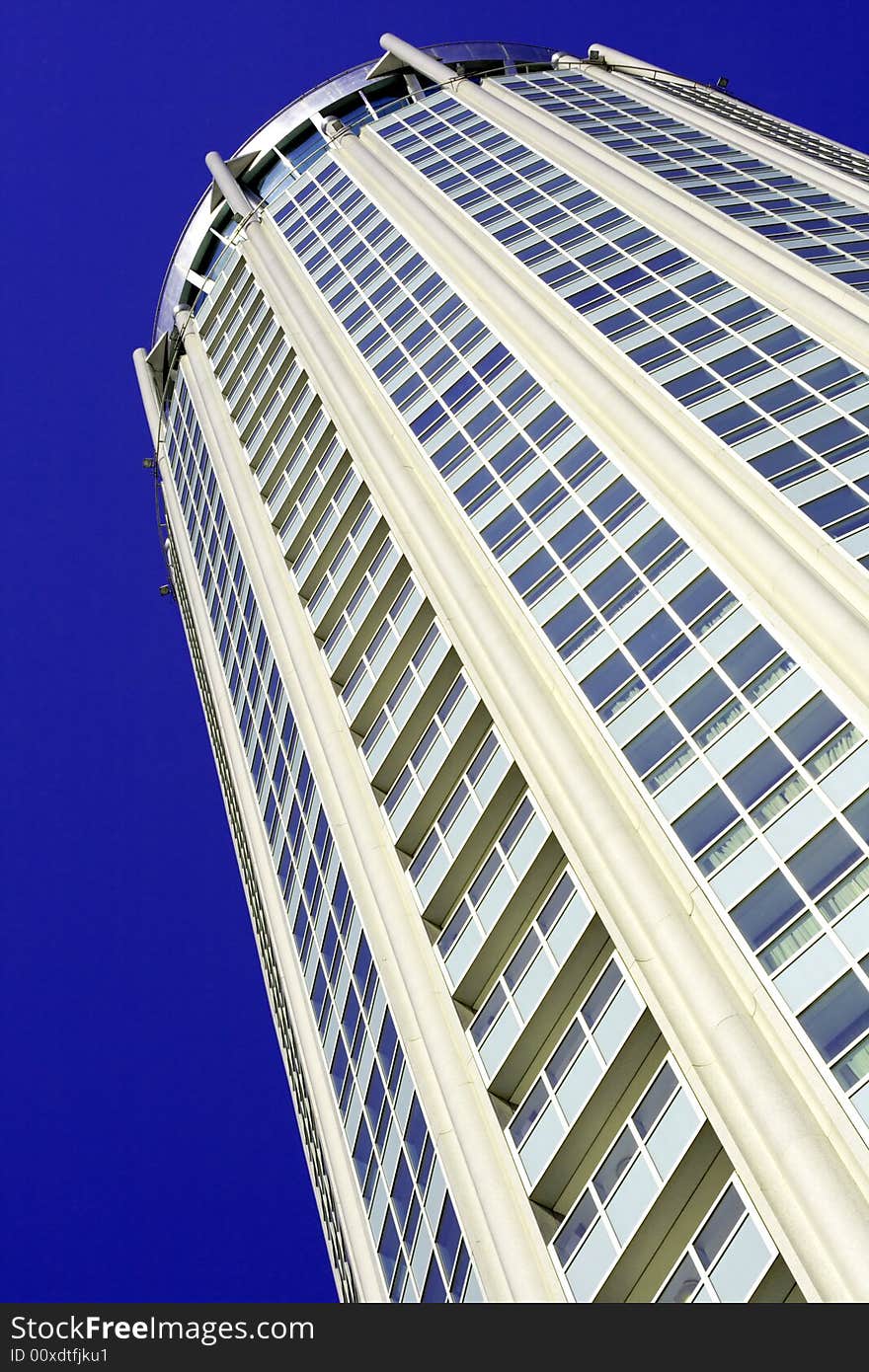 Fragment of high-tech building against the sky