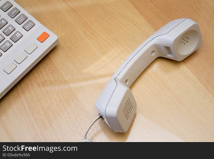 Telephone receiver laying on the table