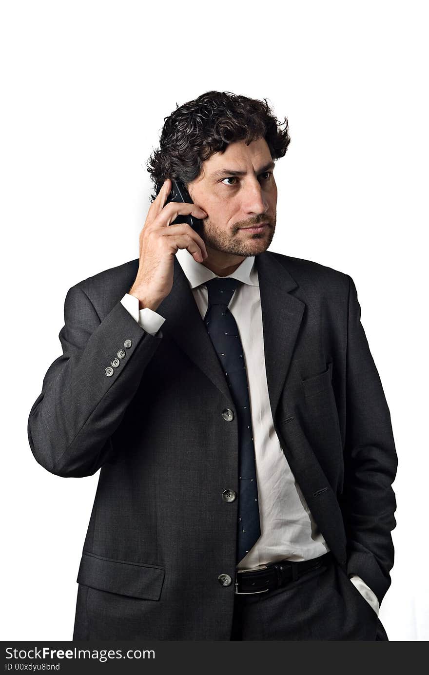 Businessman talking on the mobile phone, white background. Businessman talking on the mobile phone, white background