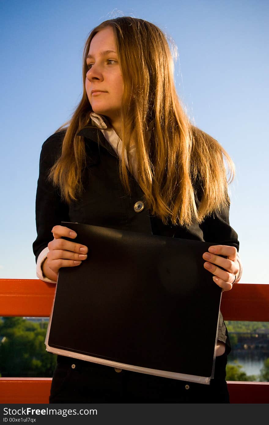 The young businesswoman with a folder