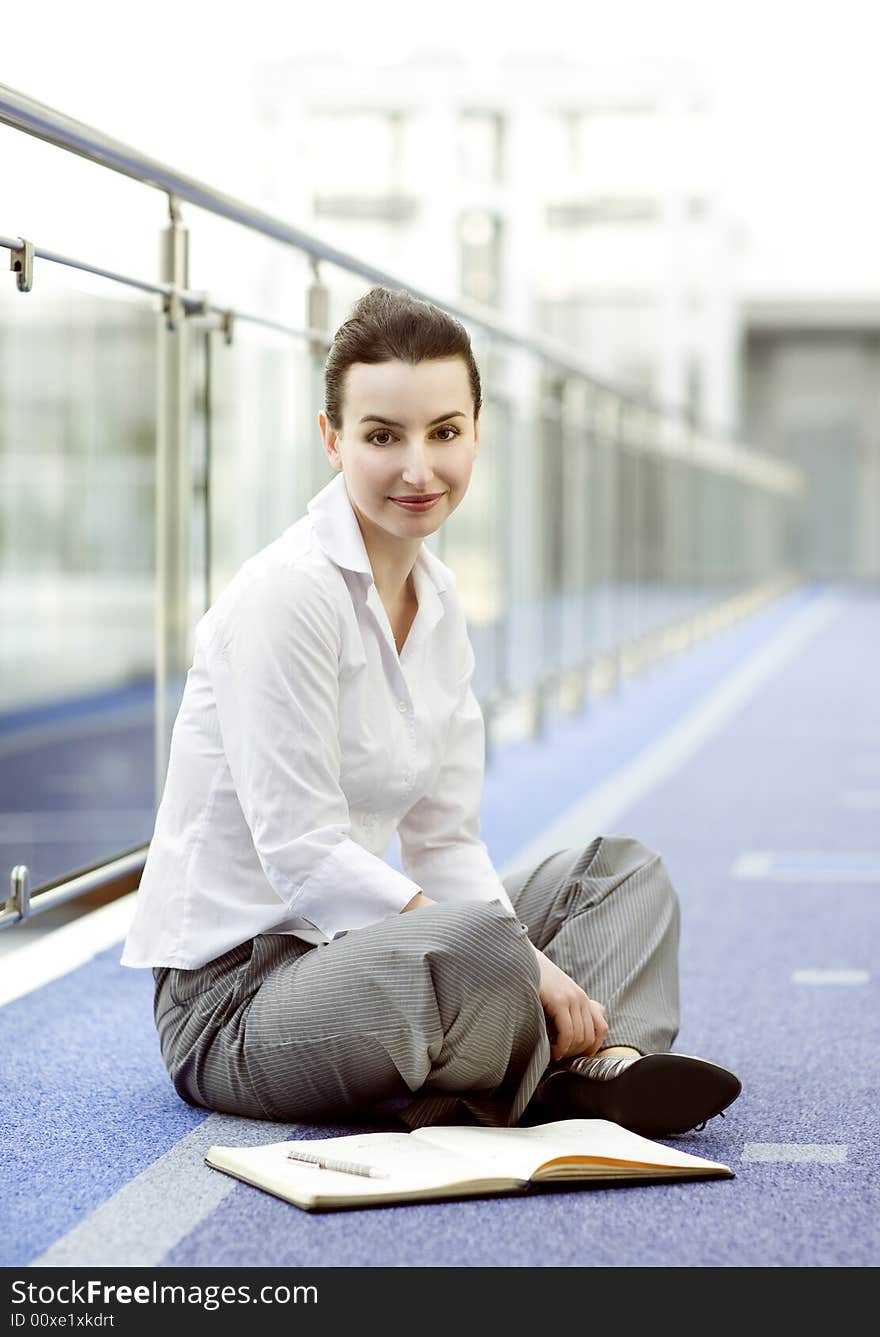 Businesswoman sitting on the floor