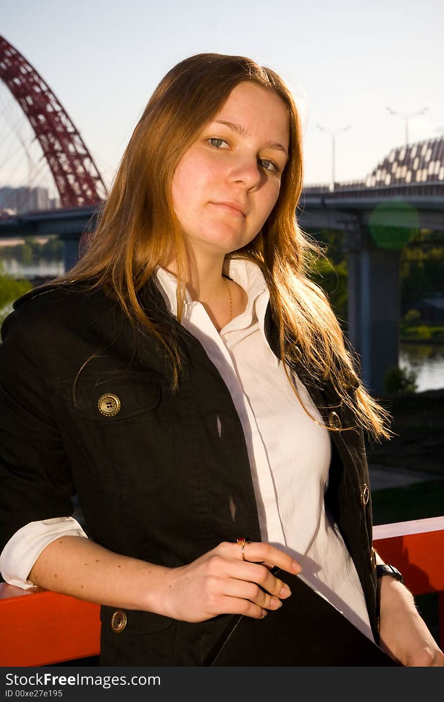 The young attractive businesswoman with a folder. The young attractive businesswoman with a folder