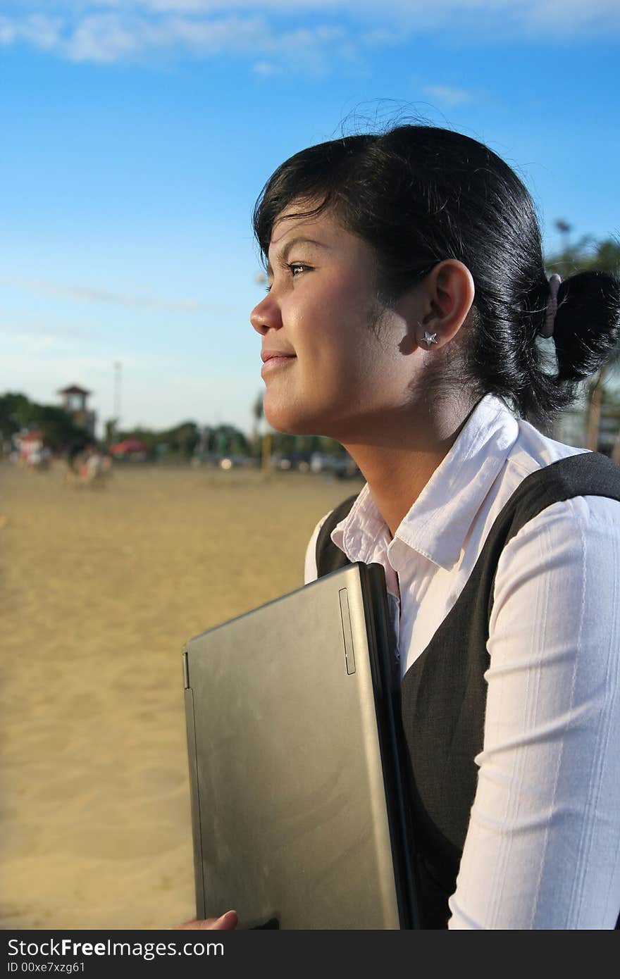 Business woman at beach with laptop. Business woman at beach with laptop